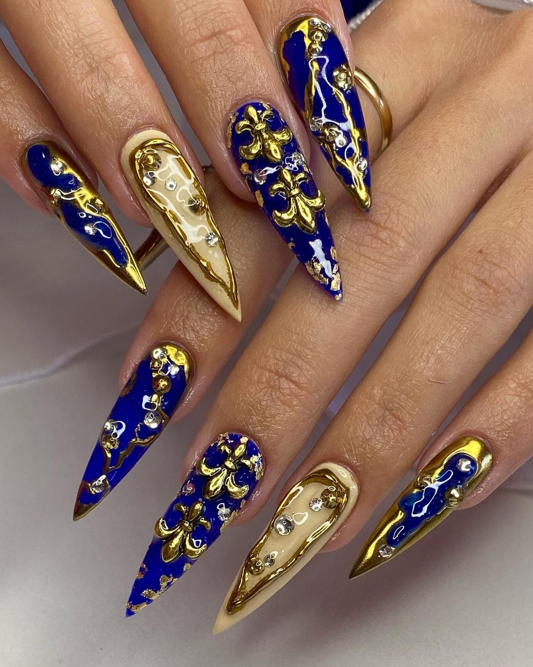 Blue and Gold Stiletto nails